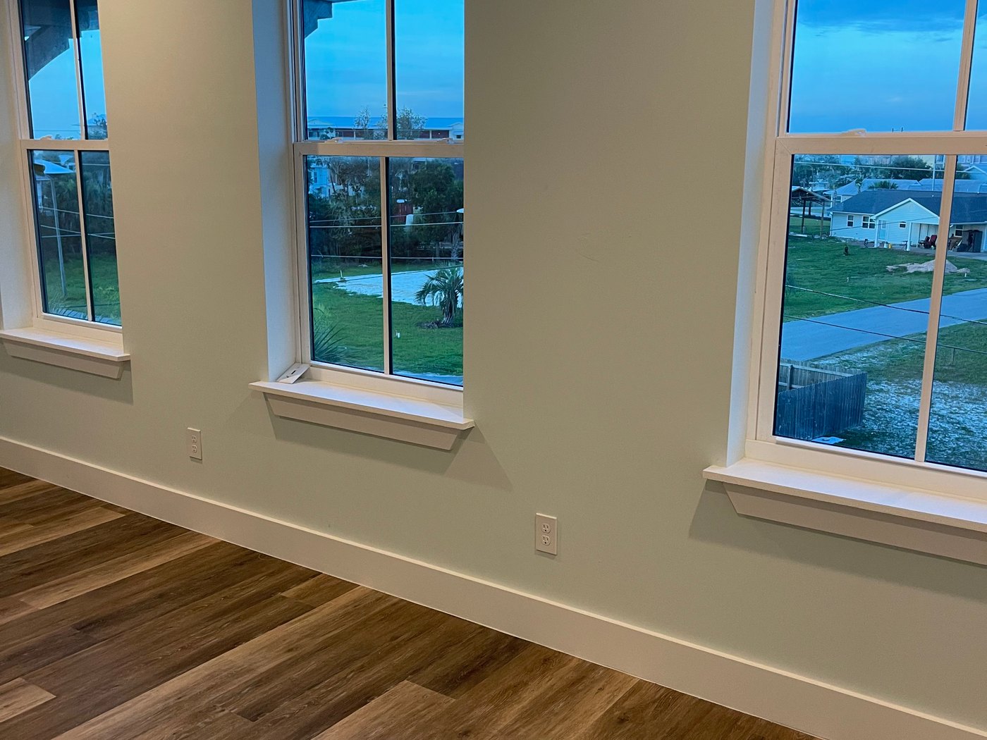 Interior windows overlooking a Florida coastal neighborhood